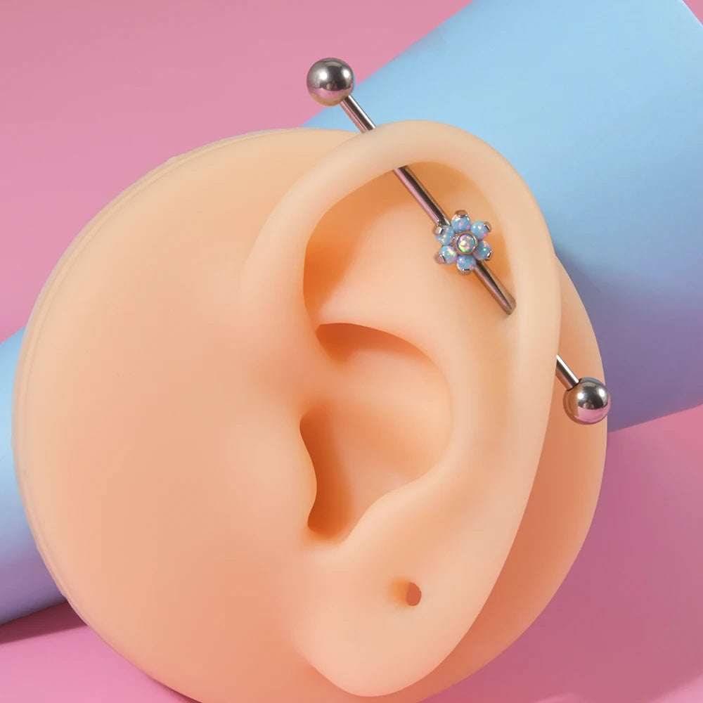 Opal industrial piercing with a flower clear white and blue opal barbell piercing titanium 14G