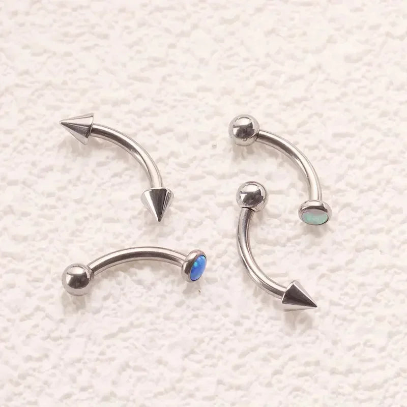 Angel fangs piercing with a short spike and a ball titanium curved barbell banana barbell 16G